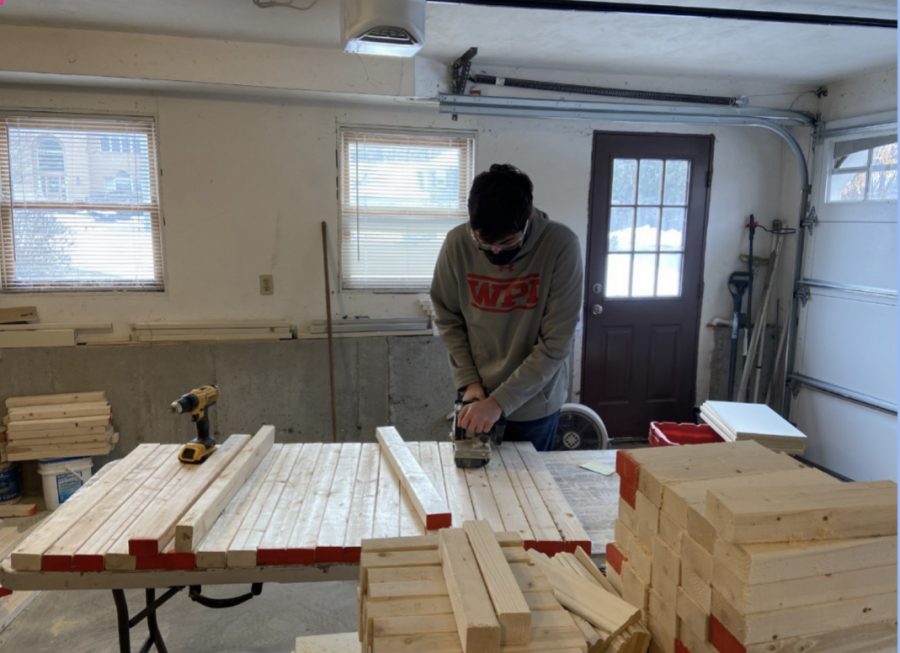 Senior Will Merry working on his desk-building project.