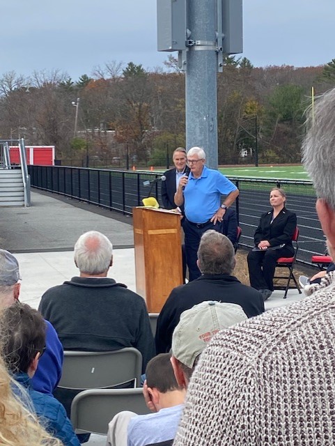Former English teacher and track coach Hal Croft speaks at the dedication of RMHSs new outdoor track.
