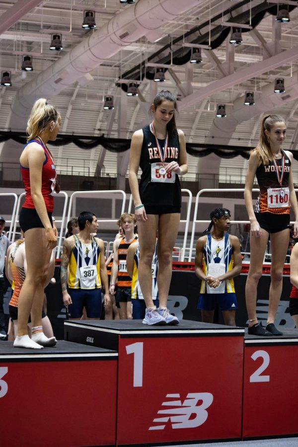 Katie Caraco (24) makes it to the top of the podium at a meet this winter.