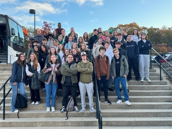French exchange students and their RMHS hosts pose on the front steps.
