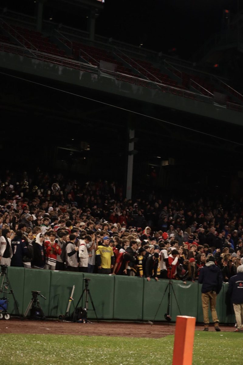 RMHS fans fill the right field grandstand for football at Fenway Park.